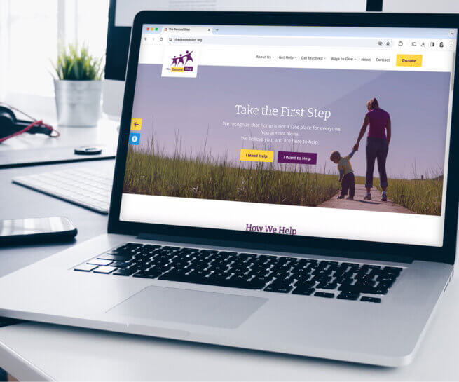 A mockup showing The Second Step homepage on a laptop screen